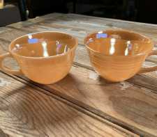 Two Vintage Fire King Peach Luster Tea Cups USA Laurel Leaf Three Bands 1960s